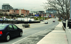 Looking north on Strachan Avenue from the railway bridge. City planners say the best plan is to connect the new street directly to Strachan Avenue at the bottom of this railway bridge. A contrary opinion says that plan won't work because there's too littl