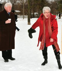 Barbara Hall shows the form that made her famous in the Wellie toss as Bob Rae looks on in wonder.