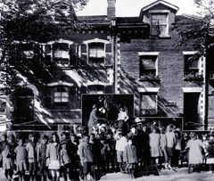 A composite shot of CNH’s first location in September 1911 was at 84 Gerrard St E. The children shown in the superimposed photo taken in 1915 are shown in fromt of the 82-84 Gerrard frontage. (CNH Archive)