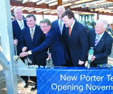 Porter Airlines unveils new $45 million terminal plans at Toronto City Centre Airport on April 27 with the help of Port Authority chair Mark McQueen, finance minister and MP Jim Flaherty, Porter president and CEO Robert Deluce, Porter chair Don Carty, tra