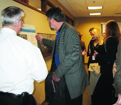 Community members view display panels like the one above, showing the potential location of the soil management stockpile.