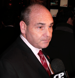 Outgoing MPP George Smitherman speaks to reporters at the Liberal Party election event