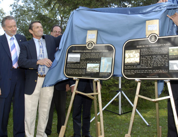 Blue Jays' CEO Paul Godfrey, Babe Ruth's grandson Tom Stevens, and Councillor Pam McConnell unveil a plaque commemorating the Babe's first home run at Hanlan's Point.