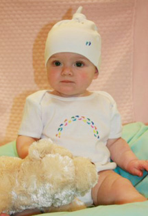 Downtown resident Baby Mia models the SickKids CareWear styles.