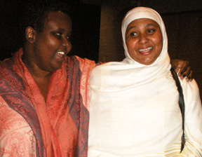 Khadra Mohamed, student parent support worker with Pathways, left, congratulates Hawo Ali, mother of graduate Kawsar.