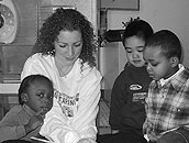 A WoodGreen volunteer helps kids (Photo: WoodGreen Community Services)